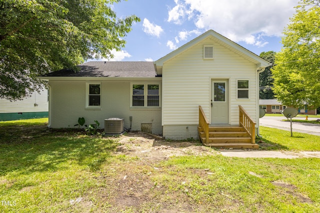 605 E Montgomery St, Henderson, NC 27536 - rear view of property with entry steps, a lawn, roof with shingles, and brick siding