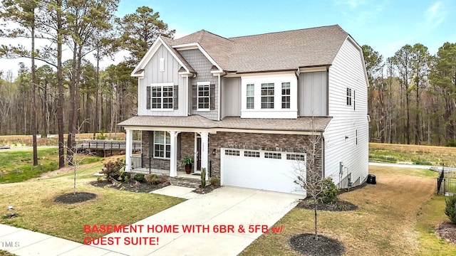 3020 Mavisbank Cir, Apex, NC 27502 - view of front of property with covered porch, board and batten siding, a front lawn, and a garage