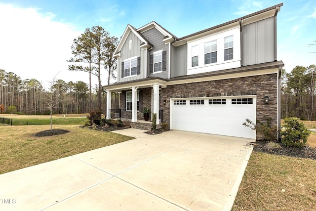 3020 Mavisbank Cir, Apex, NC 27502 - craftsman inspired home featuring board and batten siding, stone siding, a front lawn, an attached garage, and covered porch