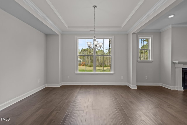 3020 Mavisbank Cir, Apex, NC 27502 - unfurnished dining area with a chandelier, dark wood-style floors, a raised ceiling, a fireplace, and baseboards