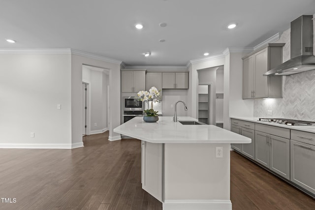 3020 Mavisbank Cir, Apex, NC 27502 - kitchen with gray cabinets, a sink, wall chimney range hood, a center island with sink, and crown molding