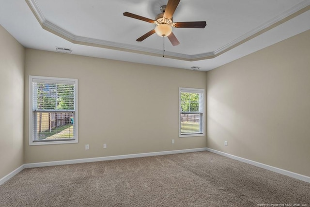 2240 Andalusian Dr, Hope Mills, NC 28348 - carpeted spare room featuring crown molding, a raised ceiling, plenty of natural light, a ceiling fan, and baseboards
