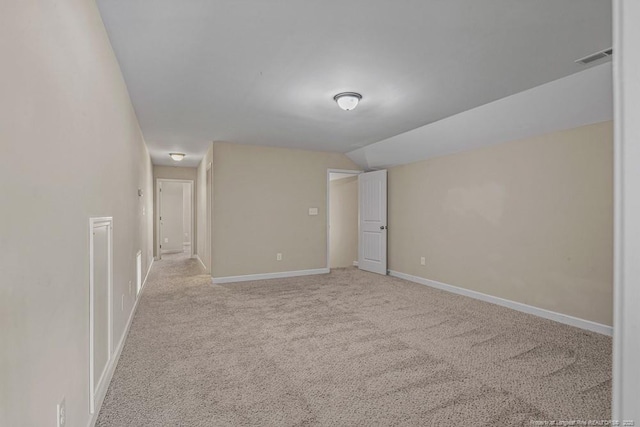 2240 Andalusian Dr, Hope Mills, NC 28348 - empty room featuring light colored carpet, lofted ceiling, and baseboards
