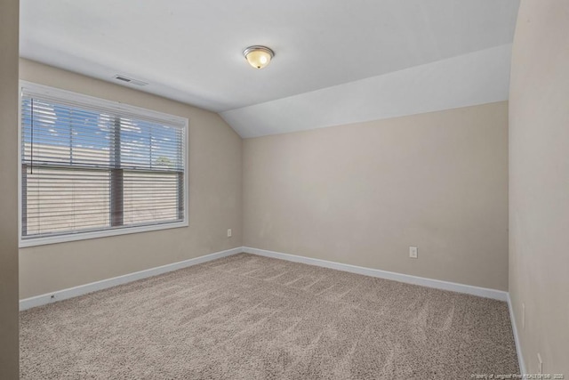 2240 Andalusian Dr, Hope Mills, NC 28348 - additional living space featuring vaulted ceiling, carpet flooring, and baseboards