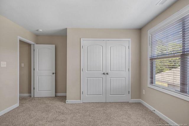 2240 Andalusian Dr, Hope Mills, NC 28348 - unfurnished bedroom with a closet, carpet flooring, and baseboards
