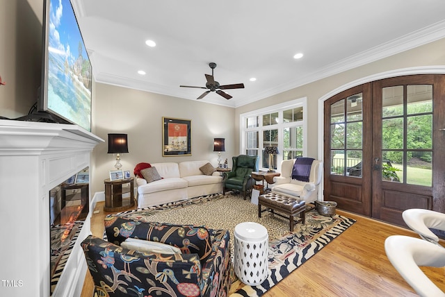 8042 N NC Highway 58, Castalia, NC 27816 - living area featuring crown molding, recessed lighting, a ceiling fan, wood finished floors, and french doors