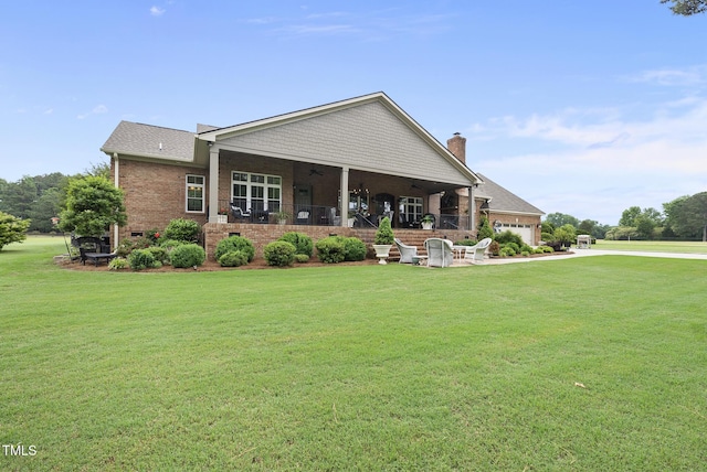 8042 N NC Highway 58, Castalia, NC 27816 - back of property featuring a yard, brick siding, a chimney, and a garage