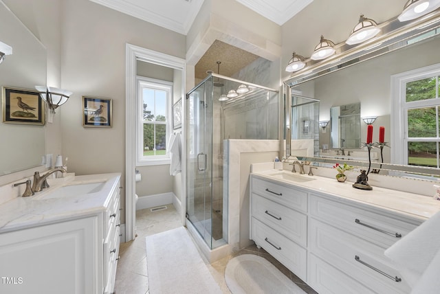 8042 N NC Highway 58, Castalia, NC 27816 - bathroom featuring crown molding, a shower stall, two vanities, and tile patterned floors