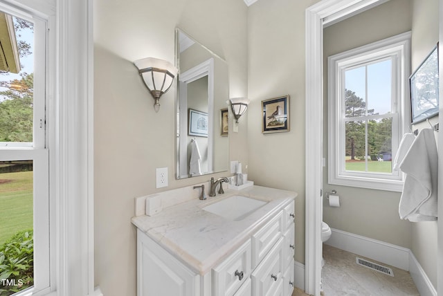 8042 N NC Highway 58, Castalia, NC 27816 - bathroom with vanity, toilet, baseboards, and healthy amount of natural light