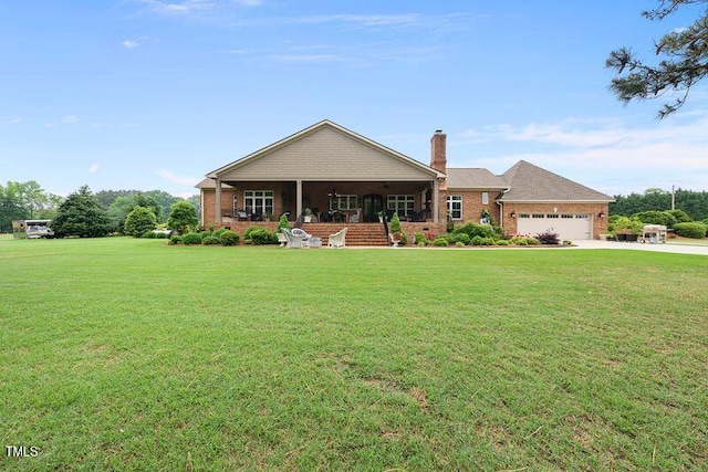 8042 N NC Highway 58, Castalia, NC 27816 - view of front of property featuring a chimney, concrete driveway, a front yard, and brick siding