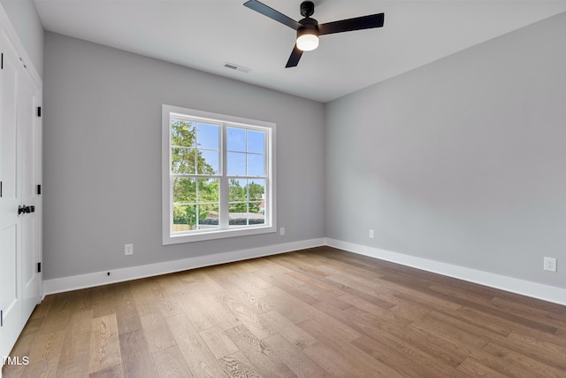 2521 Newbold St, Raleigh, NC 27603 - empty room featuring wood finished floors, a ceiling fan, and baseboards