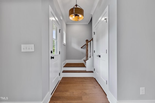 2521 Newbold St, Raleigh, NC 27603 - foyer with baseboards, wood finished floors, and stairs