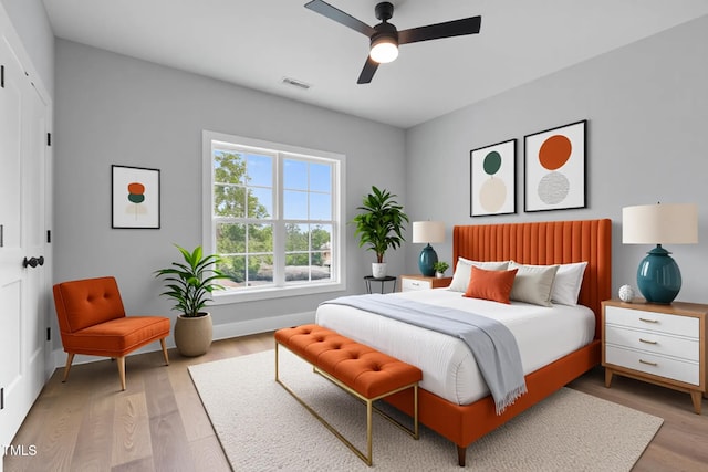 2521 Newbold St, Raleigh, NC 27603 - bedroom with light wood-style flooring, baseboards, and a ceiling fan