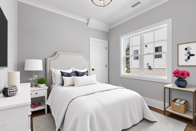 2521 Newbold St, Raleigh, NC 27603 - bedroom featuring wood finished floors and baseboards