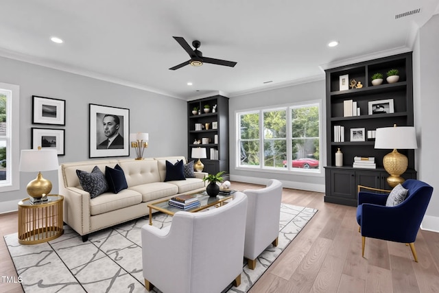 2521 Newbold St, Raleigh, NC 27603 - living room with crown molding, a ceiling fan, light wood-style floors, and recessed lighting