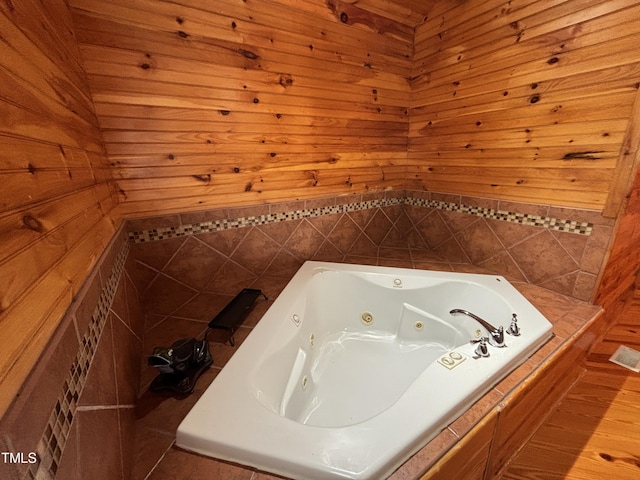 603 Hugo St, Durham, NC 27704 - bathroom with a tub with jets and wood walls