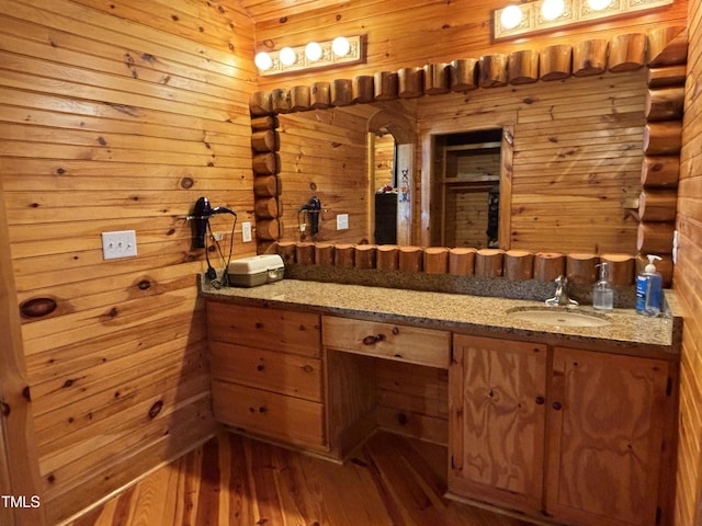 603 Hugo St, Durham, NC 27704 - bathroom featuring vanity, wood finished floors, and wood walls