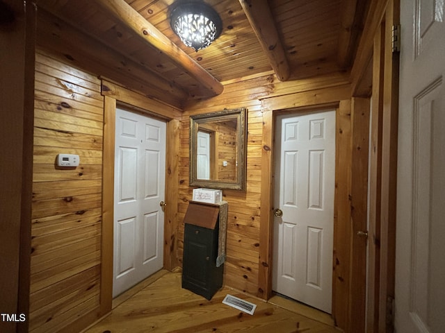 603 Hugo St, Durham, NC 27704 - doorway to outside featuring wooden walls, wooden ceiling with exposed beams, and light wood-style flooring