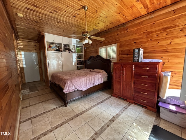 603 Hugo St, Durham, NC 27704 - bedroom featuring wooden walls, light tile patterned floors, and wooden ceiling