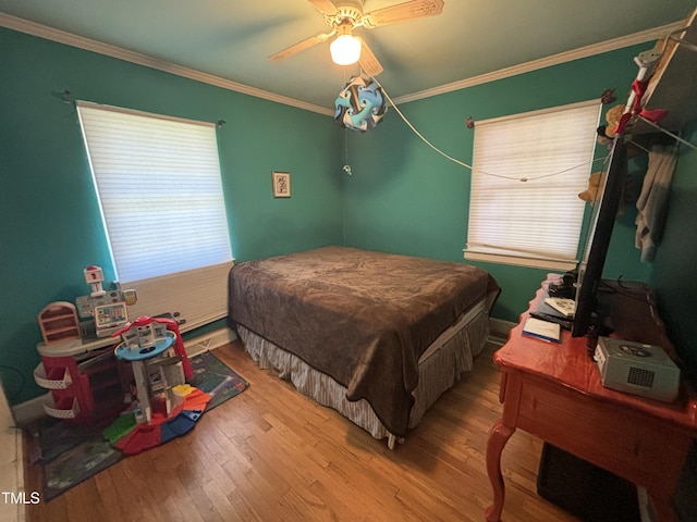 603 Hugo St, Durham, NC 27704 - bedroom featuring multiple windows, wood finished floors, ornamental molding, ceiling fan, and baseboards