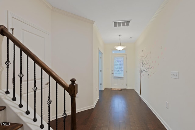 317 Springhurst Ln, Cary, NC 27511 - foyer entrance with wood finished floors, crown molding, baseboards, and stairs