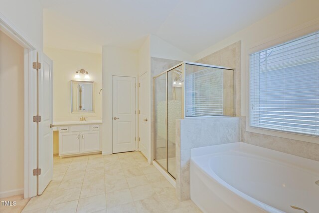 317 Springhurst Ln, Cary, NC 27511 - bathroom featuring a garden tub, vanity, a shower stall, and tile patterned flooring