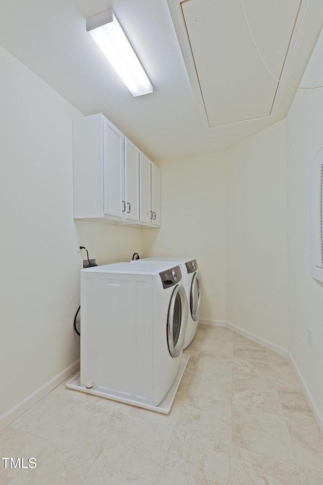317 Springhurst Ln, Cary, NC 27511 - laundry area featuring attic access, cabinet space, washer and clothes dryer, and baseboards