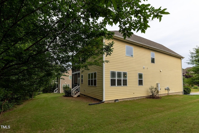 317 Springhurst Ln, Cary, NC 27511 - rear view of property featuring entry steps and a lawn