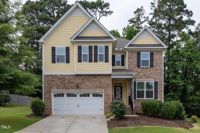 317 Springhurst Ln, Cary, NC 27511 - craftsman-style house with a garage, stone siding, and concrete driveway