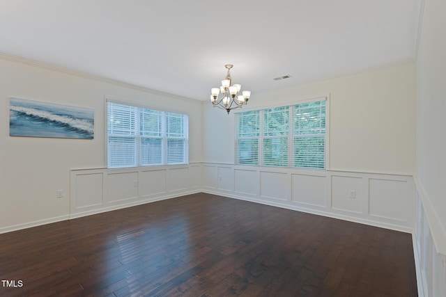 317 Springhurst Ln, Cary, NC 27511 - spare room featuring a chandelier, ornamental molding, plenty of natural light, dark wood-type flooring, and a decorative wall