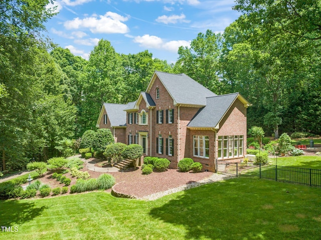 1317 Woodgate Manor Ct, Raleigh, NC 27614 - rear view of property with brick siding and roof with shingles