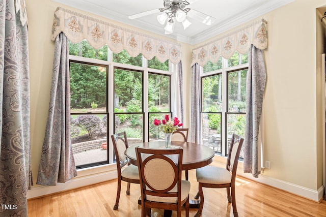 1317 Woodgate Manor Ct, Raleigh, NC 27614 - dining area featuring crown molding, a ceiling fan, and light wood-type flooring