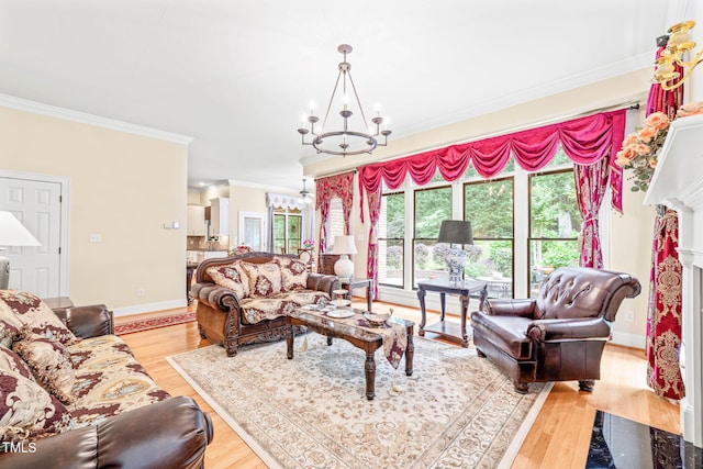 1317 Woodgate Manor Ct, Raleigh, NC 27614 - living room featuring crown molding, a chandelier, light wood-type flooring, and a premium fireplace