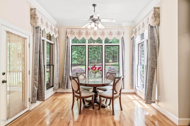1317 Woodgate Manor Ct, Raleigh, NC 27614 - dining area featuring light wood finished floors, ceiling fan, and crown molding