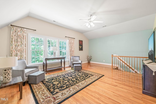 1317 Woodgate Manor Ct, Raleigh, NC 27614 - living area with lofted ceiling, wood finished floors, a ceiling fan, and an upstairs landing