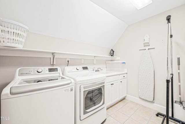 1317 Woodgate Manor Ct, Raleigh, NC 27614 - washroom featuring separate washer and dryer, cabinet space, and light tile patterned floors