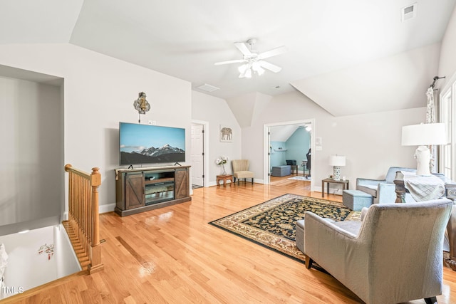 1317 Woodgate Manor Ct, Raleigh, NC 27614 - living area with lofted ceiling, a ceiling fan, and light wood finished floors