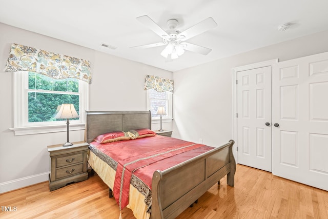 1317 Woodgate Manor Ct, Raleigh, NC 27614 - bedroom featuring light wood finished floors, a closet, and ceiling fan