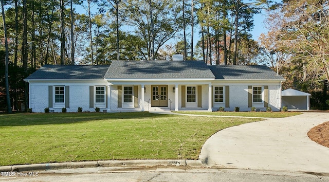 1204 Windemere Pl, Wilson, NC 27893 - view of front of property with covered porch, a front lawn, driveway, and brick siding