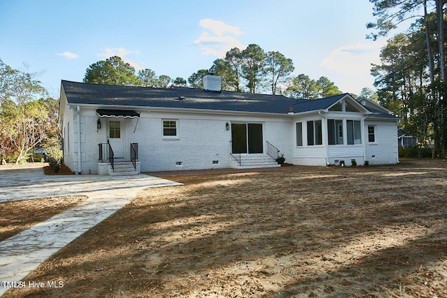 1204 Windemere Pl, Wilson, NC 27893 - rear view of property with entry steps, a chimney, brick siding, and crawl space