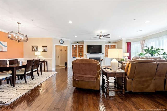220 Hugh Shelton Loop, Fayetteville, NC 28303 - living area with ornamental molding, a fireplace, a ceiling fan, dark wood finished floors, and a chandelier