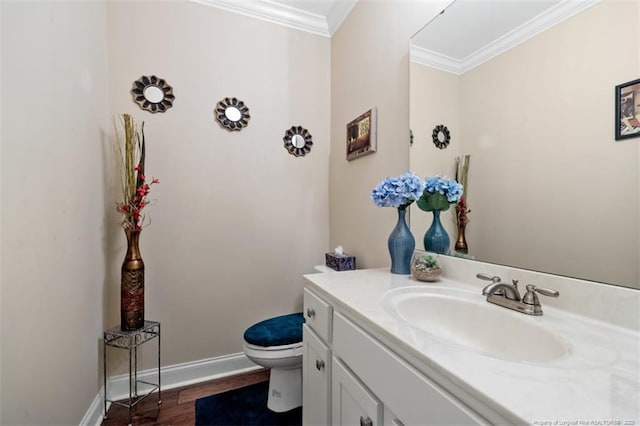 220 Hugh Shelton Loop, Fayetteville, NC 28303 - bathroom with ornamental molding, vanity, toilet, baseboards, and wood finished floors