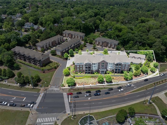 220 Hugh Shelton Loop, Fayetteville, NC 28303 - aerial view of property and surrounding area with a forest and property boundaries highlighted