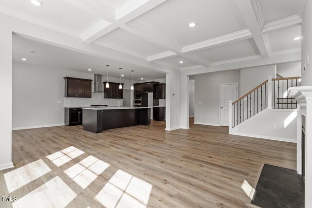 219 Berry Mill Ln Unit 179, Raleigh, NC 27603 - kitchen with open floor plan, beam ceiling, wall chimney exhaust hood, coffered ceiling, and light wood-type flooring