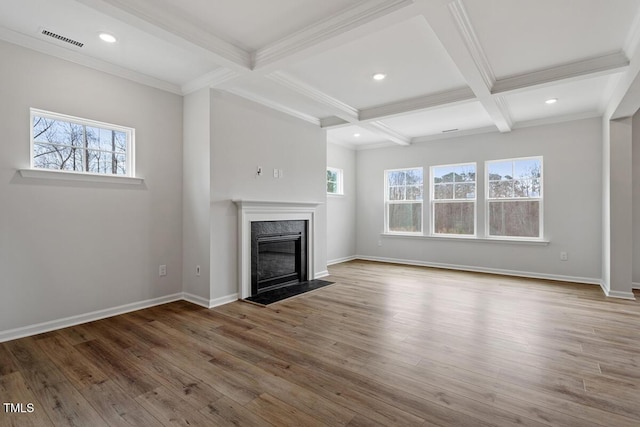 219 Berry Mill Ln Unit 179, Raleigh, NC 27603 - unfurnished living room featuring healthy amount of natural light, beamed ceiling, coffered ceiling, a fireplace, and wood finished floors