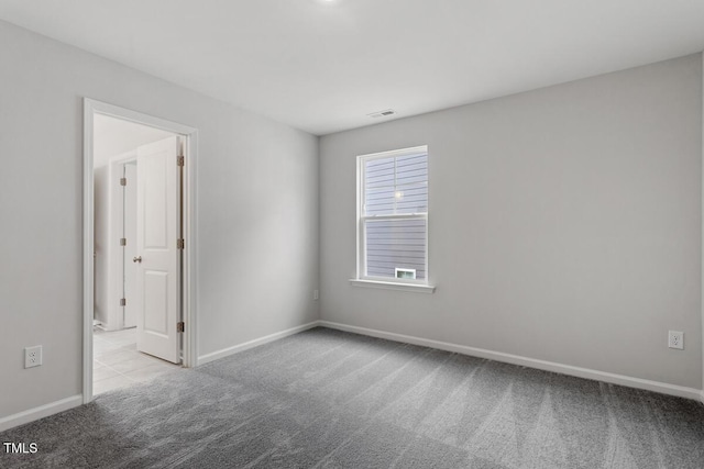 219 Berry Mill Ln Unit 179, Raleigh, NC 27603 - spare room with carpet floors and baseboards