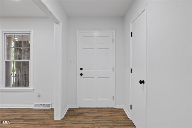 5110 Old Well St, Durham, NC 27704 - foyer with dark wood finished floors and baseboards