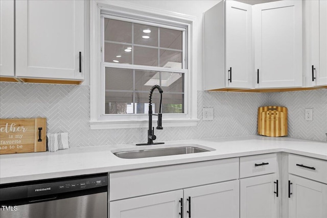 5110 Old Well St, Durham, NC 27704 - kitchen with stainless steel dishwasher, a sink, decorative backsplash, and white cabinetry