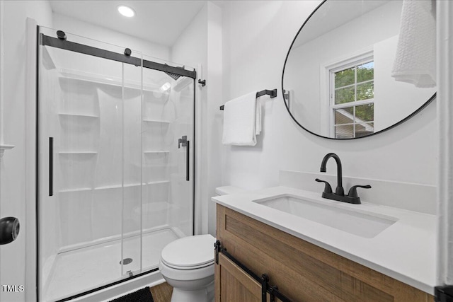 5110 Old Well St, Durham, NC 27704 - full bath with toilet, a shower stall, vanity, and recessed lighting