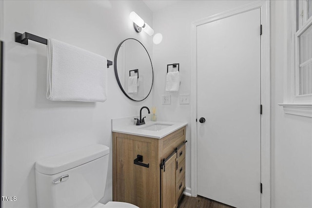 5110 Old Well St, Durham, NC 27704 - bathroom featuring toilet, vanity, and wood finished floors